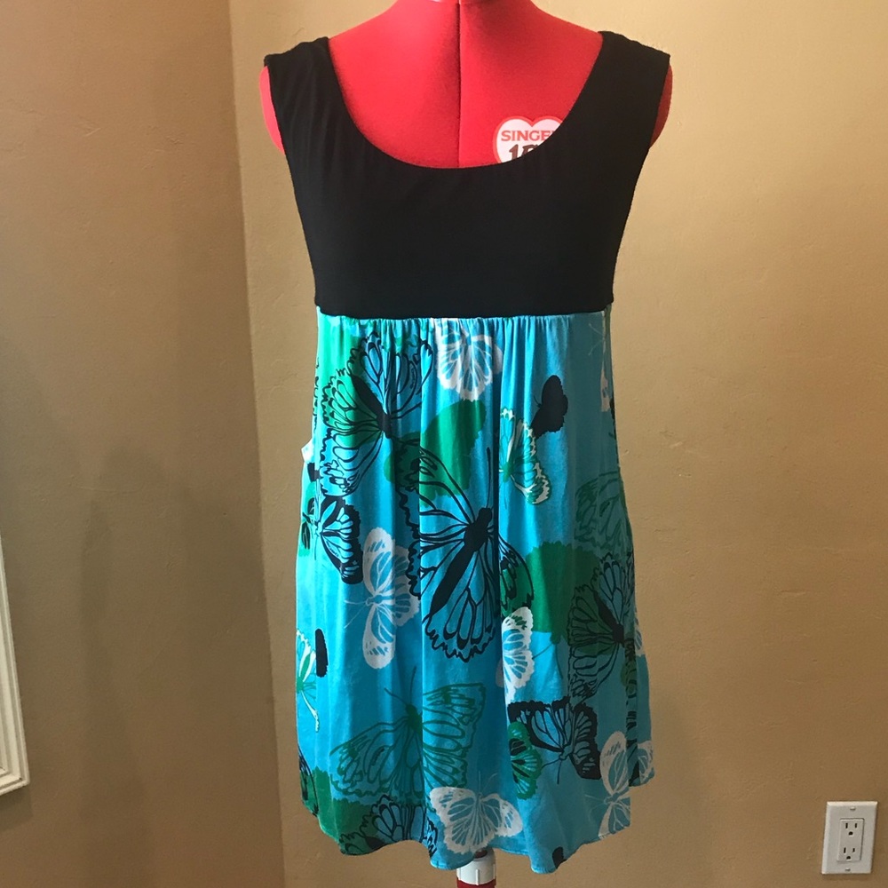 Stylish bebe top or short dress.